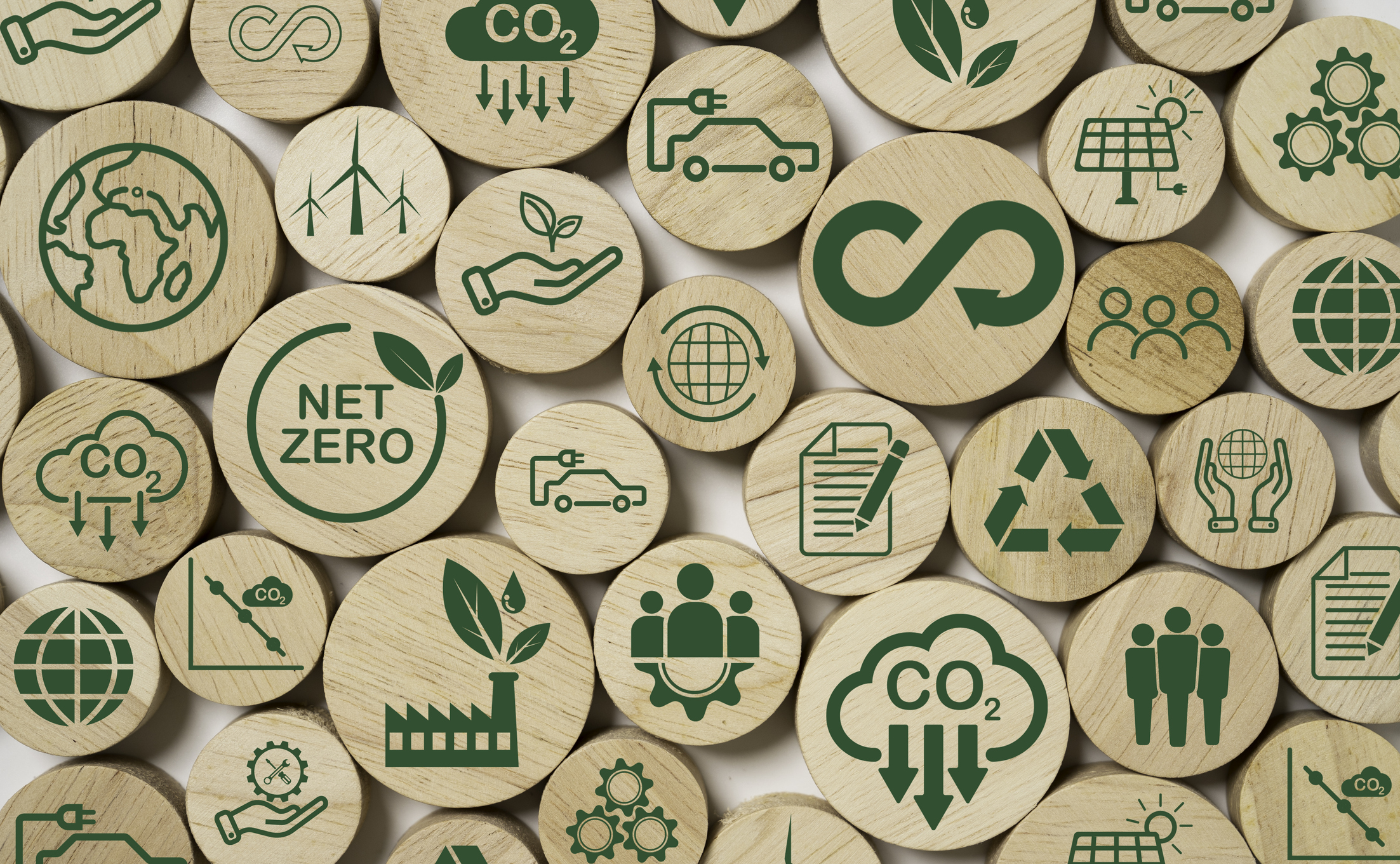 Little wooden pieces showing all the aspects that make up green sustainability