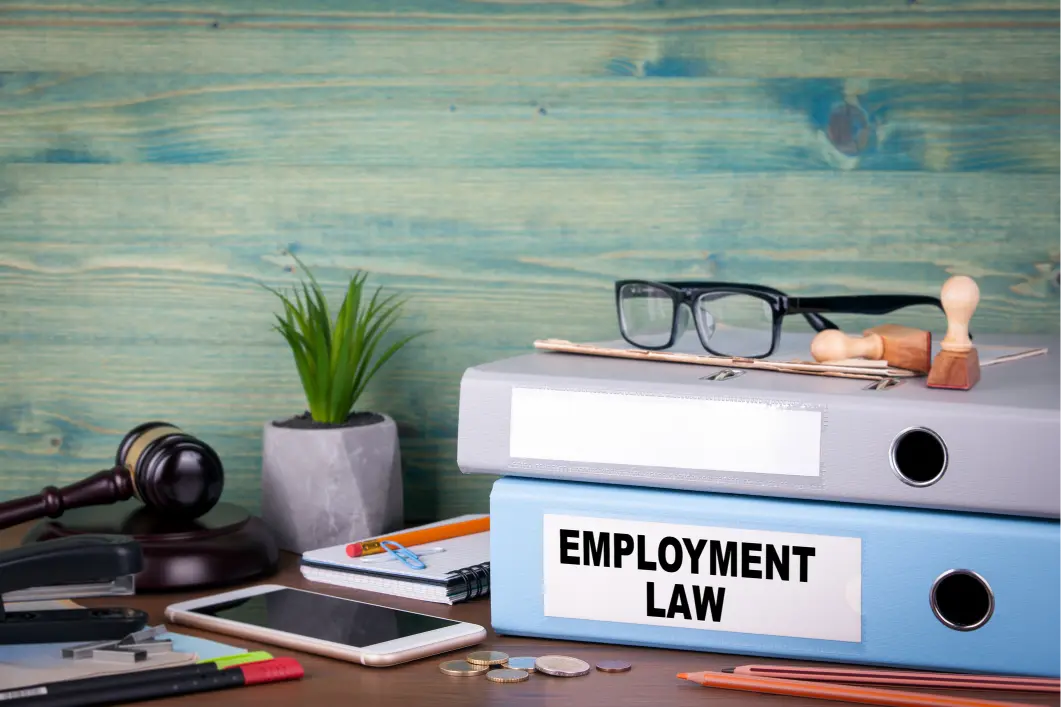 Employment Law Concept with an office desk and employment law file 