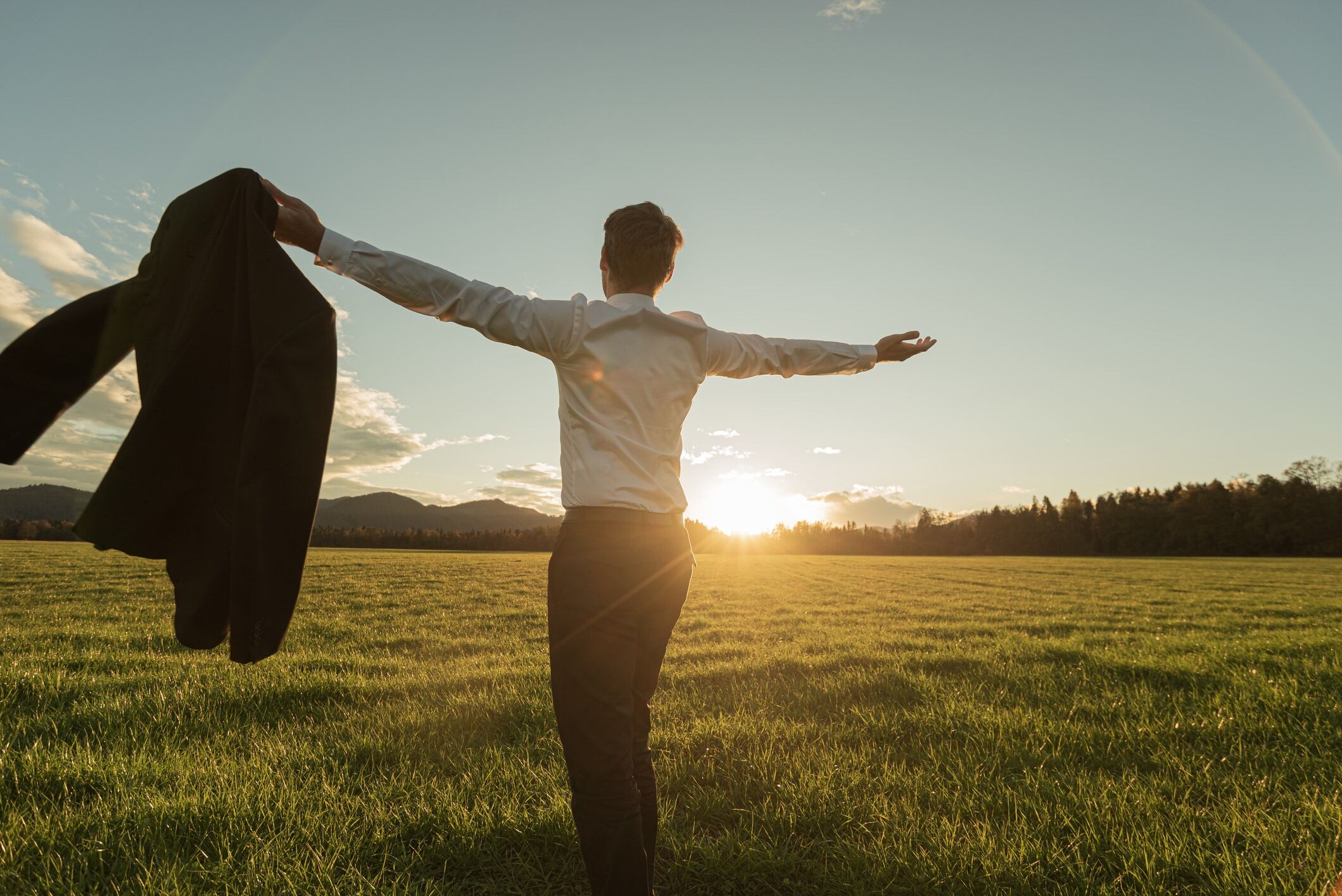 A man in a suit in a field