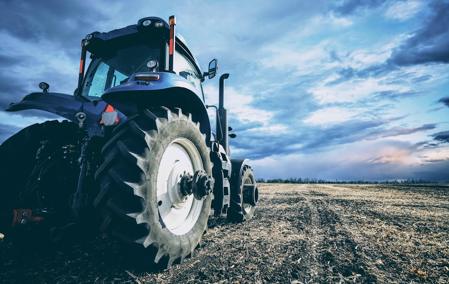 Blue tractor in a field