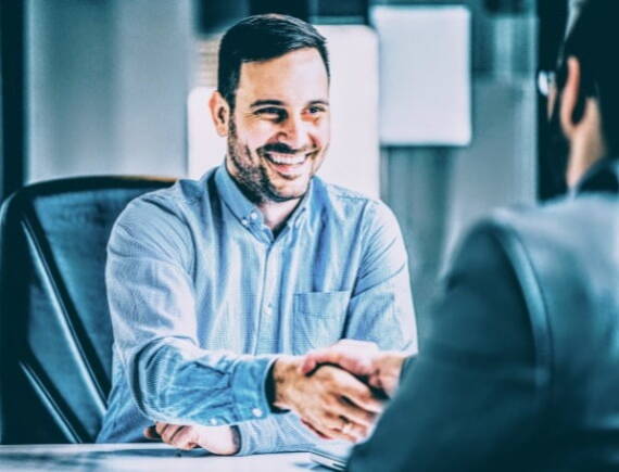 businessman shaking hand at interview